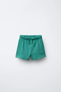 TEXT PLUSH SHORTS