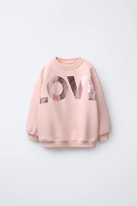 SWEAT À INSCRIPTION BRILLANTE