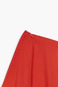 ASYMMETRIC FLOWING CAPE