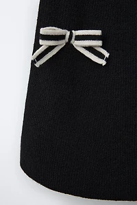 JUPE EN MAILLE AVEC LACETS