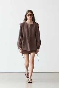 Flowing oversize linen blouse with ruffles