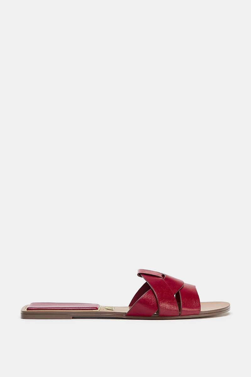 FLAT CROSSED LEATHER SANDALS