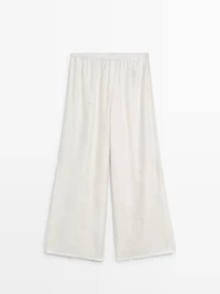 Flowing stretch trousers with fabric detail
