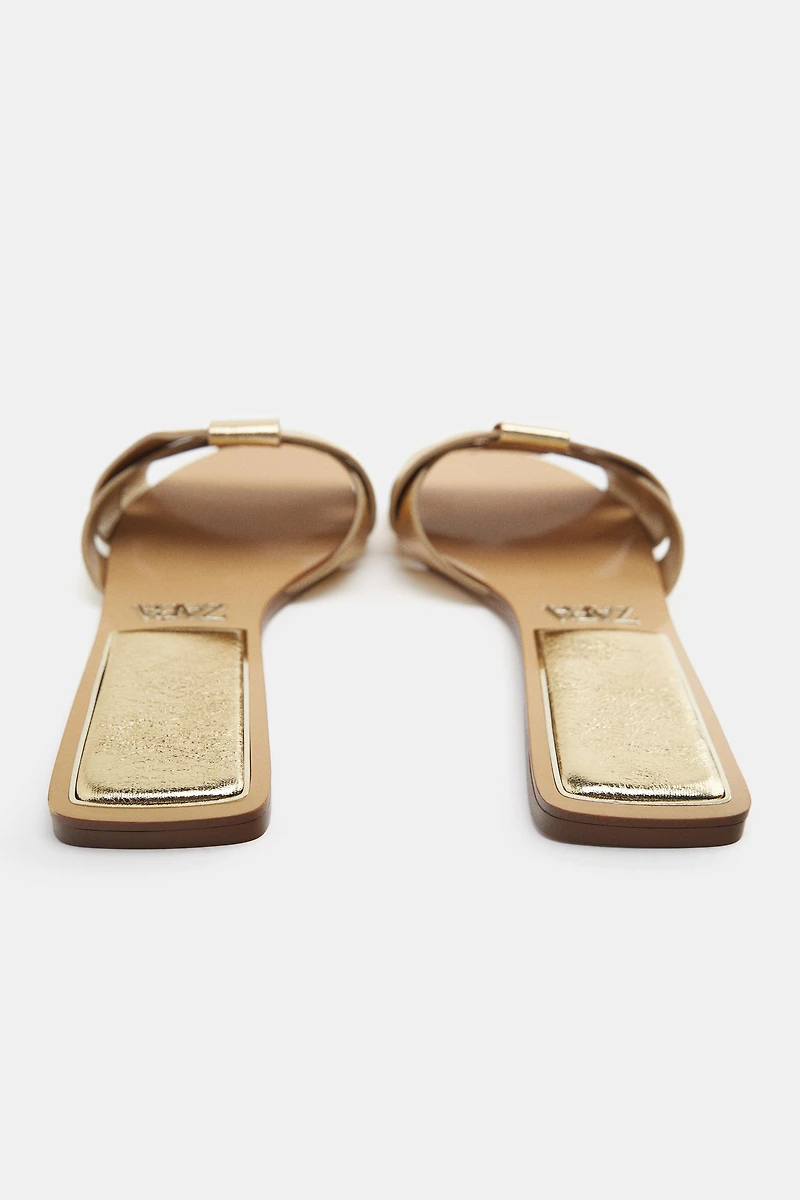 FLAT CROSSED LEATHER SANDALS