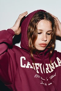 SWEAT VARSITY À VOLANT