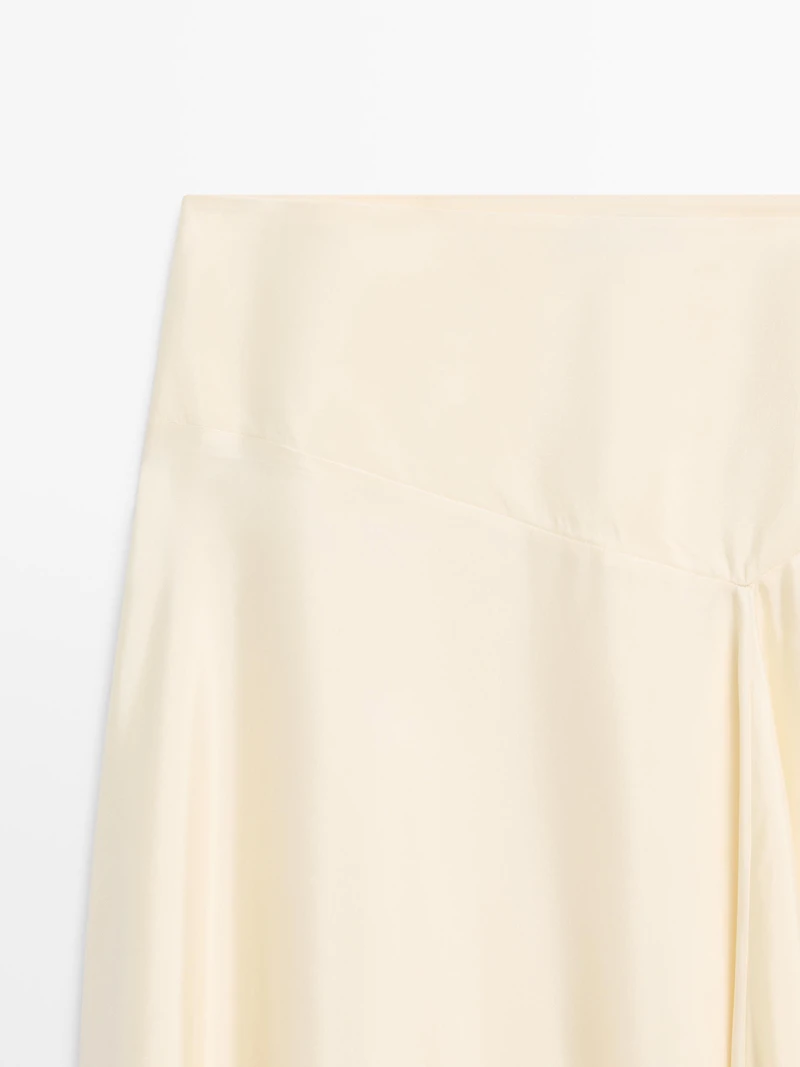 Asymmetric skirt with lace-trimmed detail