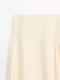 Asymmetric skirt with lace-trimmed detail