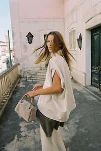 ASYMMETRIC INTERLOCK CAPE