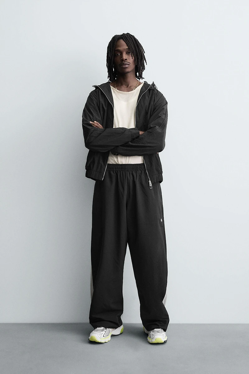 TECHNICAL PANTS WITH STRIPES