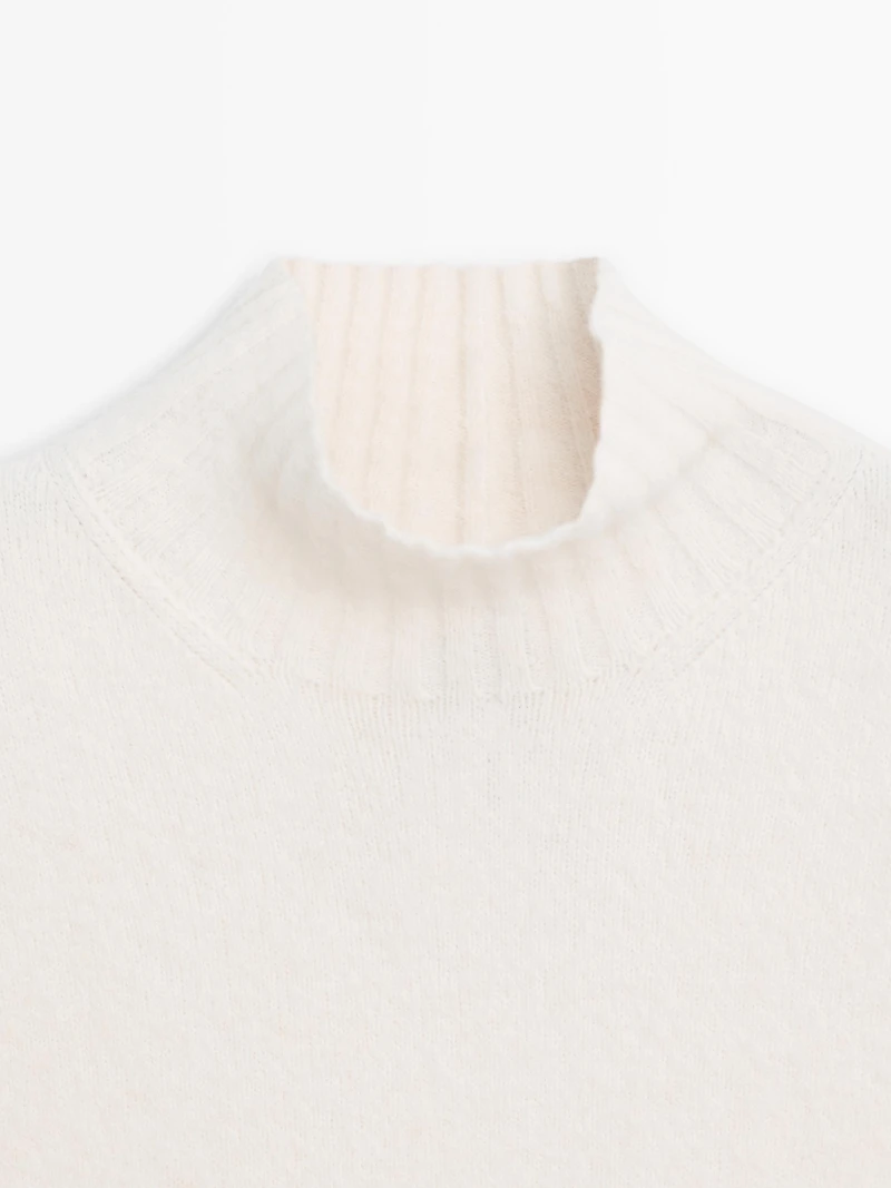 Sleeveless high neck sweater