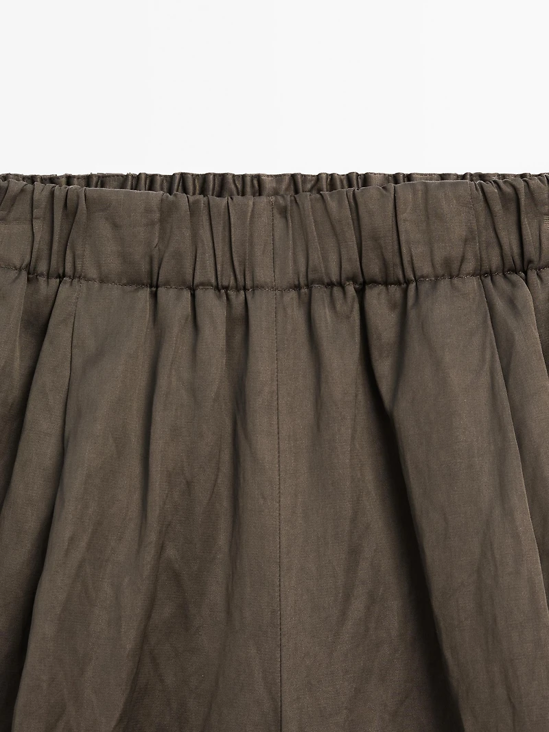 Wide-leg satin trousers with creased effect