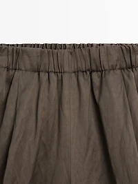 Wide-leg satin trousers with creased effect