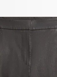 Waxed flare fit trousers