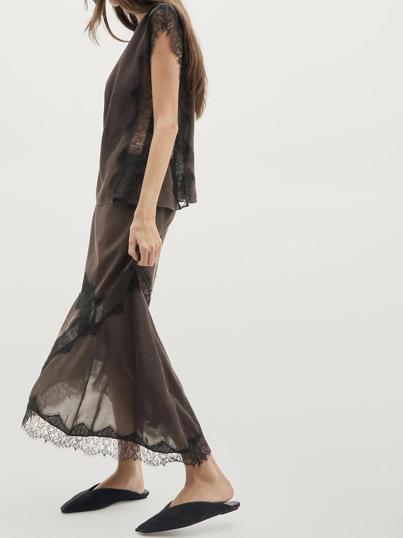 Flowing asymmetric midi skirt with lace detail