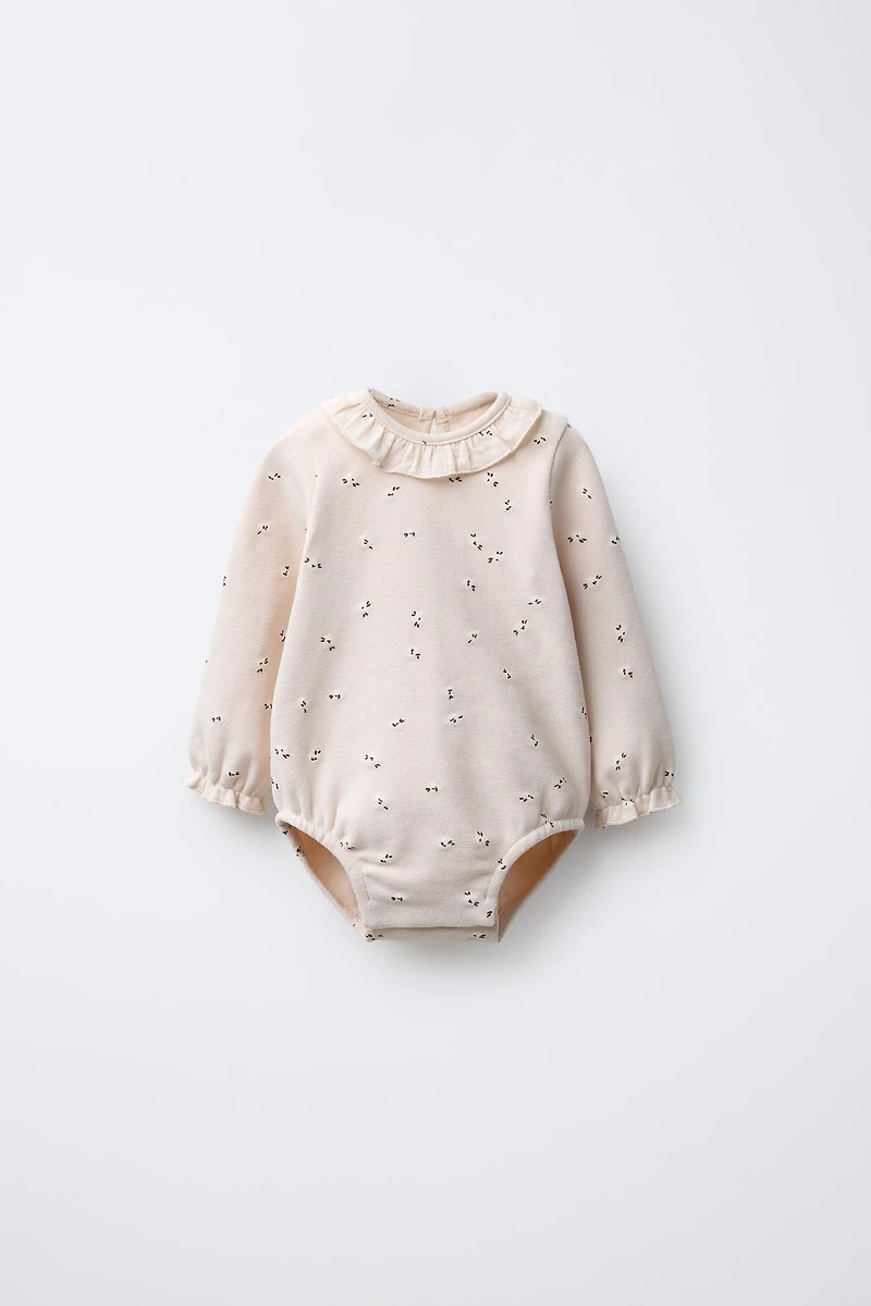 WARM FLORAL BODYSUIT