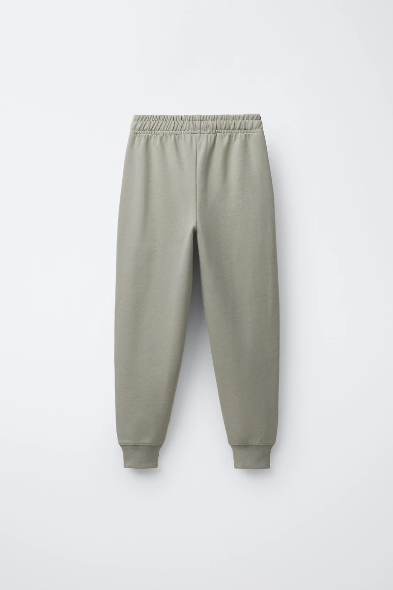 ENSEMBLE INTERLOCK SWEAT ET JOGGER INSCRIPTION EN RELIEF