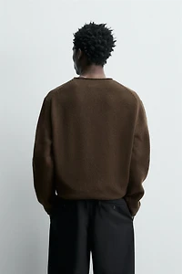 100% WOOL ROLLED-EDGE SWEATER