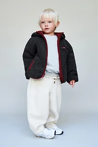 VESTE RÉVERSIBLE DÉPERLANTE EN MOUTON SYNTHÉTIQUE