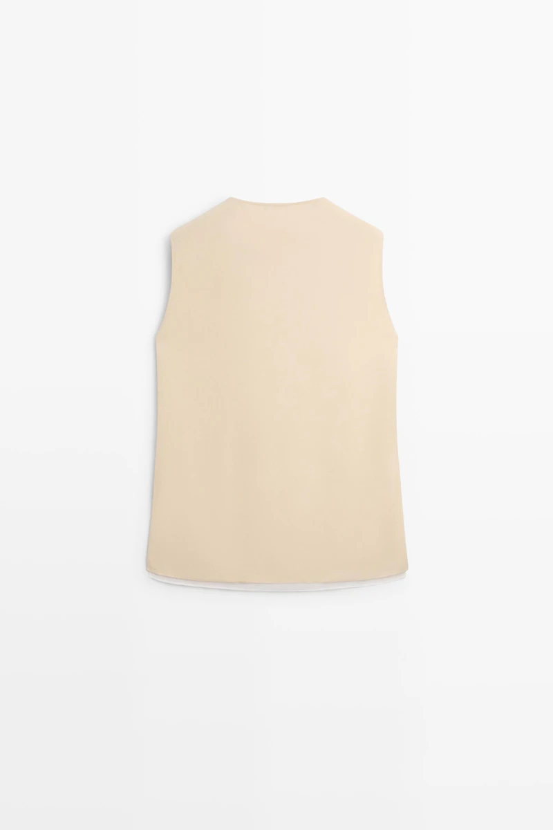 Flowing double-layer top with contrast detail