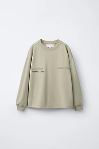 WASHED EFFECT EMBOSSED TEXT T-SHIRT