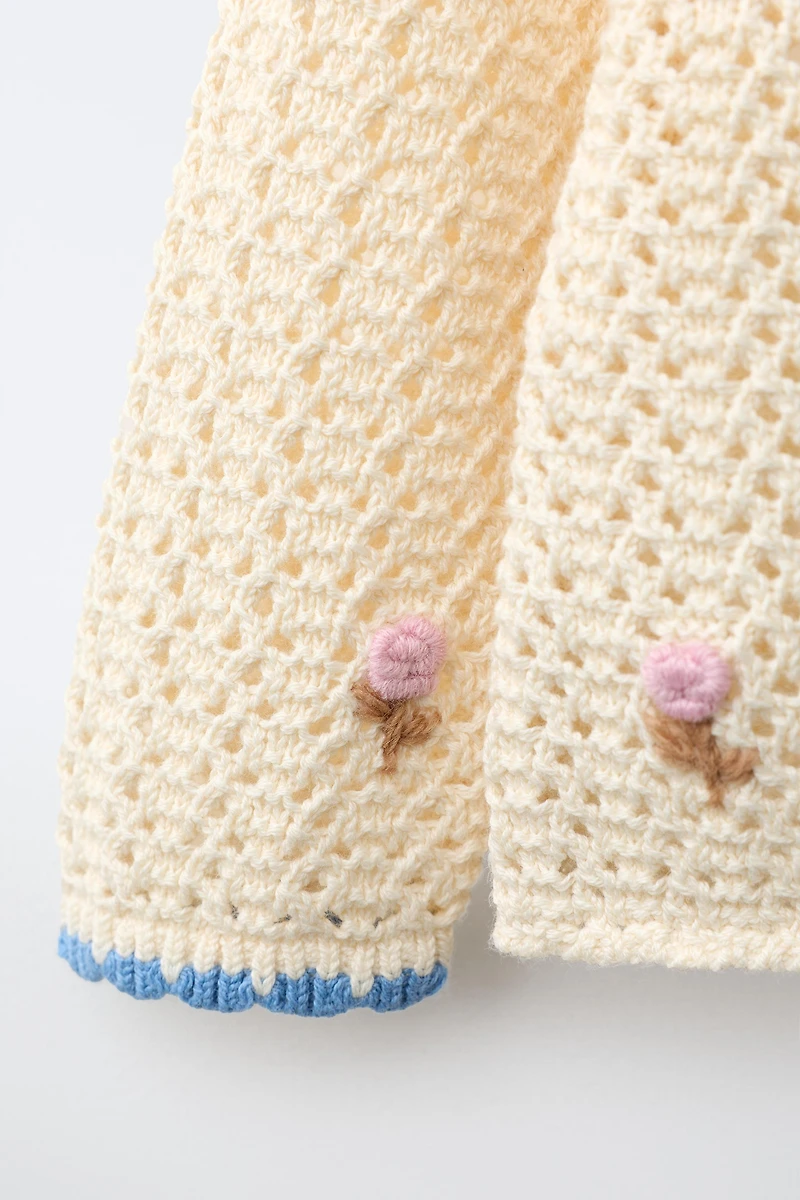VESTE BRODÉE POMPONS