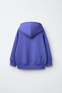 SWEAT À CAPUCHE AVEC INSCRIPTION