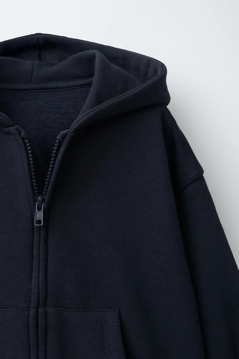 SWEAT ZIPPÉ À CAPUCHE