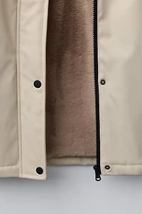 RUBBERIZED WATER RESISTANT FUR EFFECT RAINCOAT