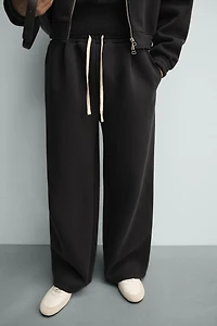 TECHNICAL PLEATED JOGGER PANTS