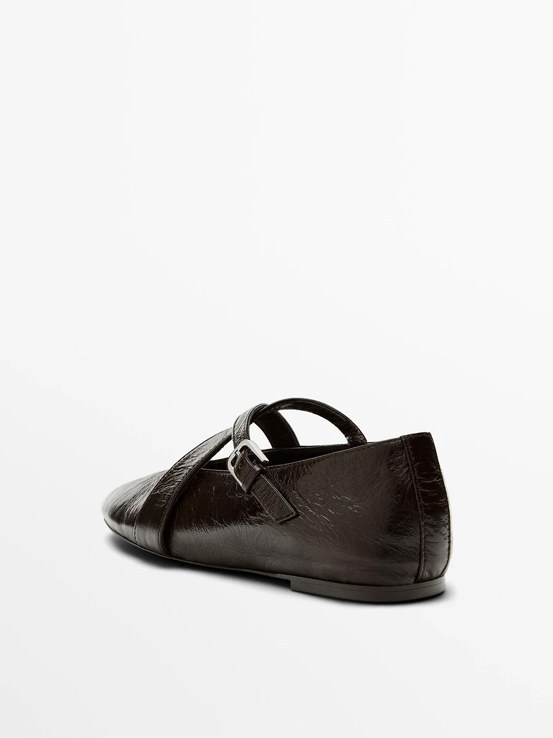 Ballet flats with criss-cross straps and buckle
