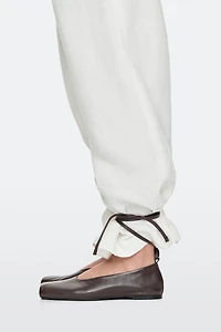 Tied leather ballet flats