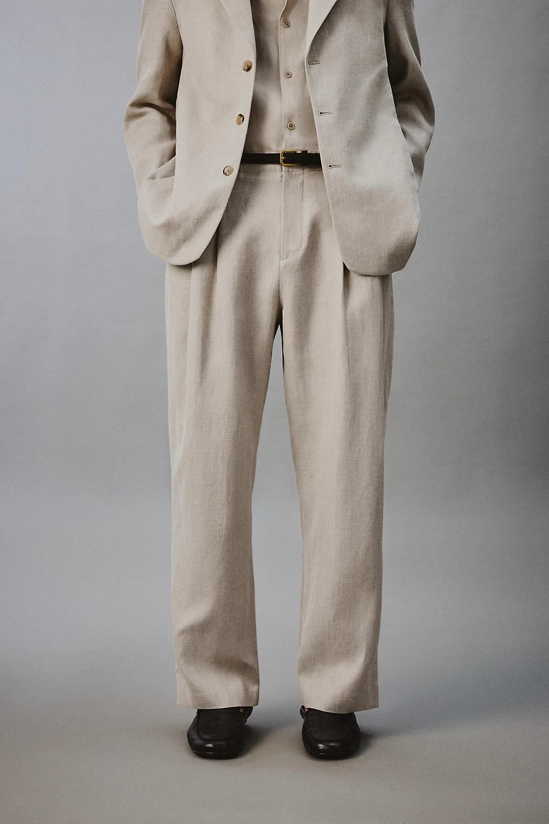 PANTALON À PLIS EN COTON ET LIN