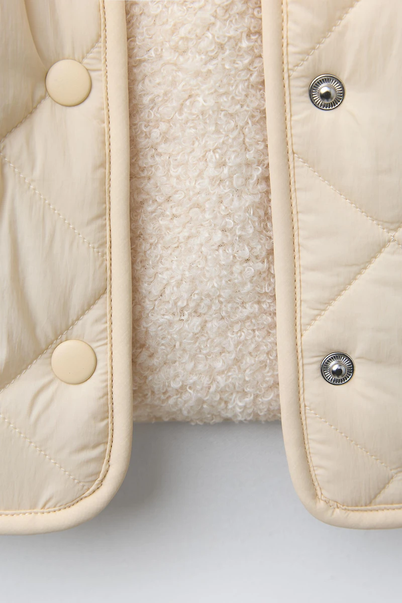 WATER REPELLENT NYLON FAUX SHEARLING JACKET