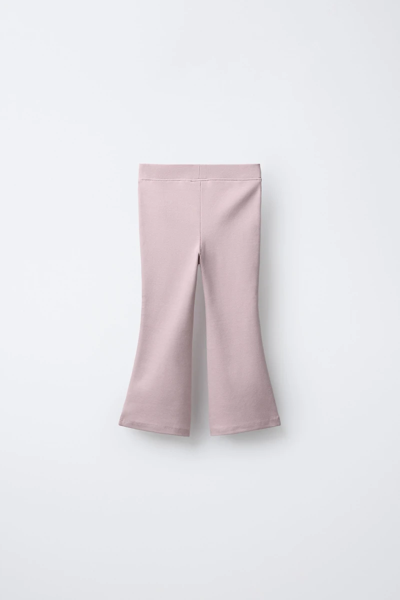 INTERLOCK FLARE LEGGINGS WITH LABEL DETAIL