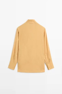 Flowing blouse with draped neckline