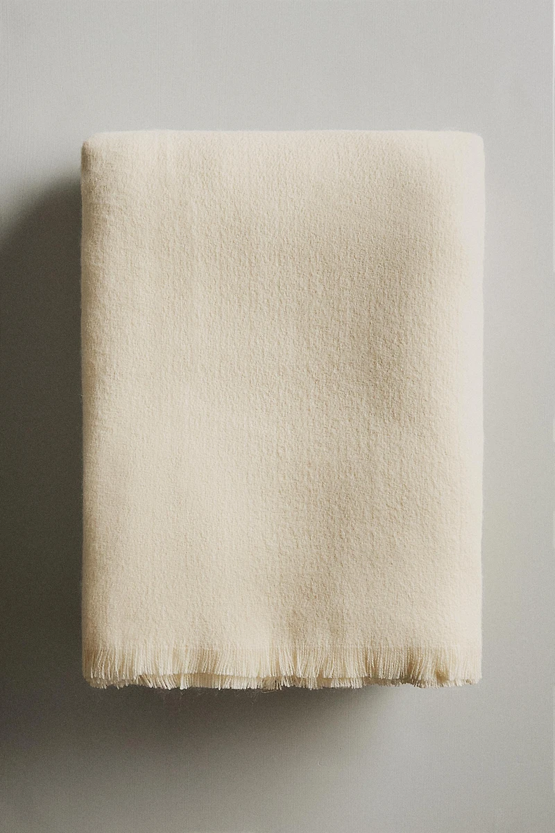 DECORATIVE FRINGED BLANKET