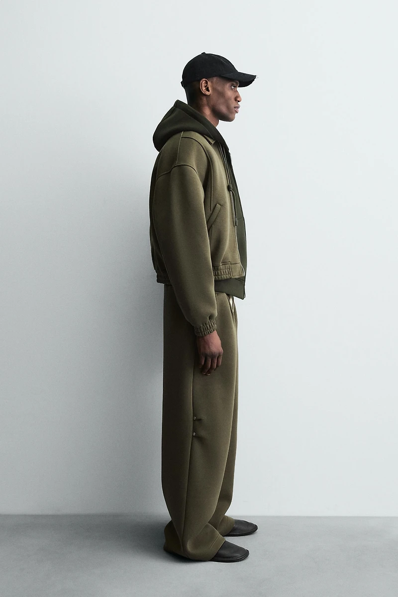 WIDE FIT NEOPRENE EFFECT PANTS WITH STUDS