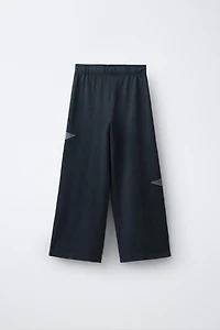 PANTALON EN MOLLETON EFFET DÉLAVÉ À JAMBES LARGES ÉTOILES
