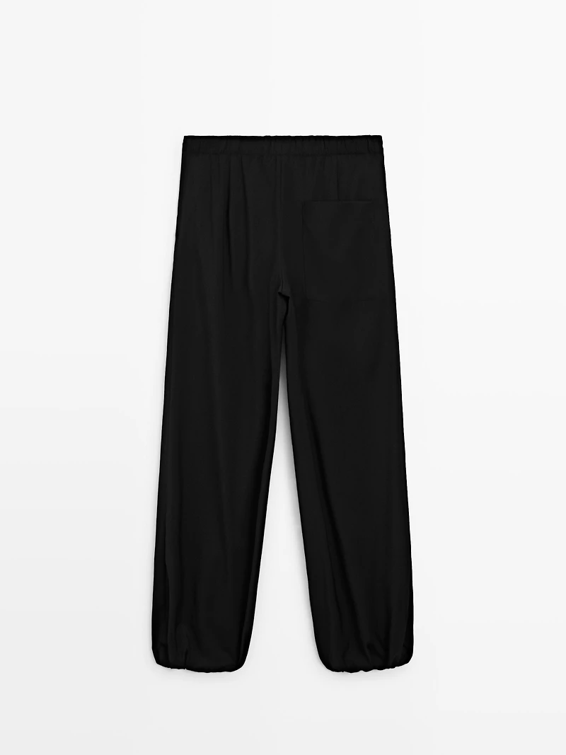 Wool sarouel trousers with tie detail