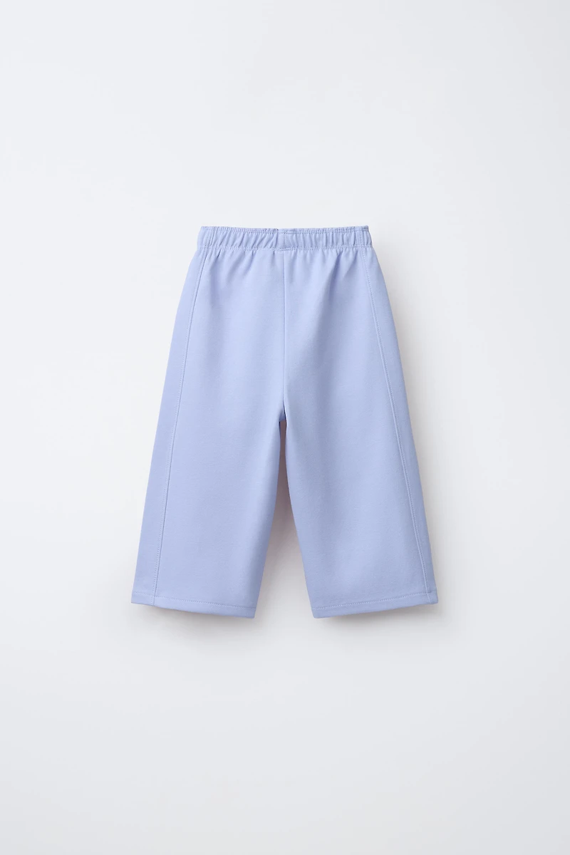 PANTALON WIDE LEG INTERLOCK INSCRIPTION EN RELIEF