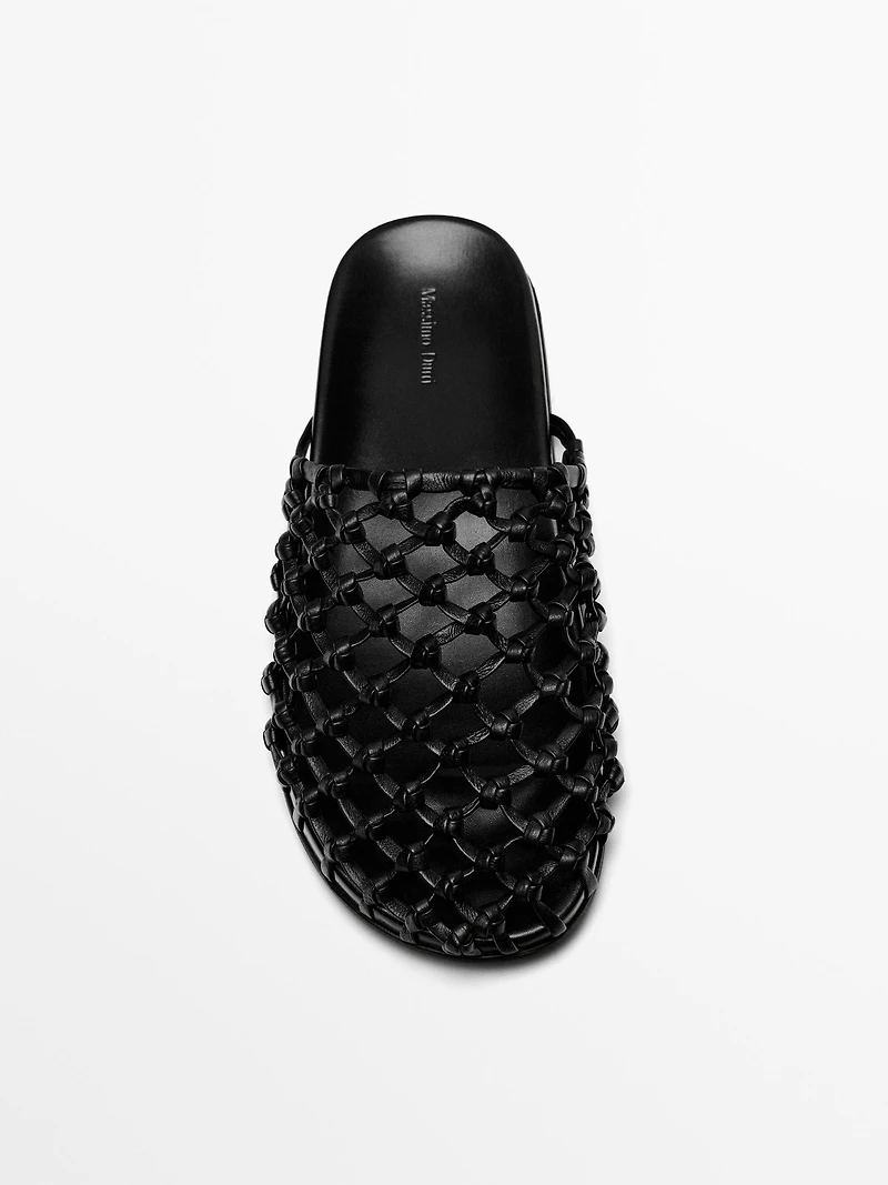 Woven leather clogs