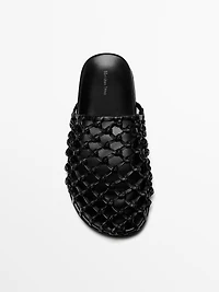 Woven leather clogs