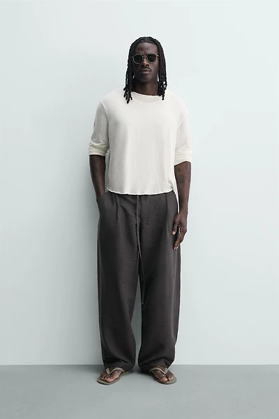 BALLOON FIT PLEATED BELTED PANTS