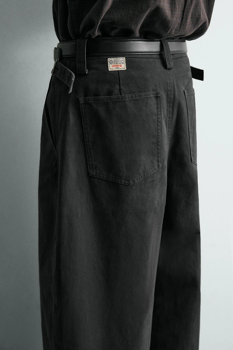 RELAXED FIT PANTS WITH TWISTED SEAM