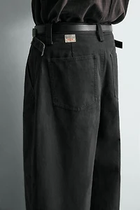 RELAXED FIT PANTS WITH TWISTED SEAM