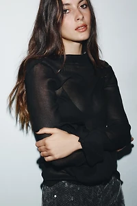 TOP À VOLANTS EN MATIÈRES VARIÉES