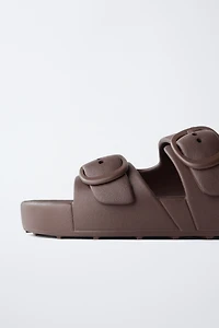 RUBBERIZED BUCKLED SANDALS