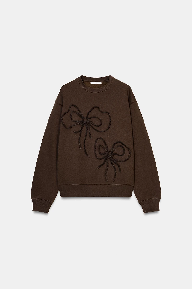 EMBOSSED BOW SWEATSHIRT