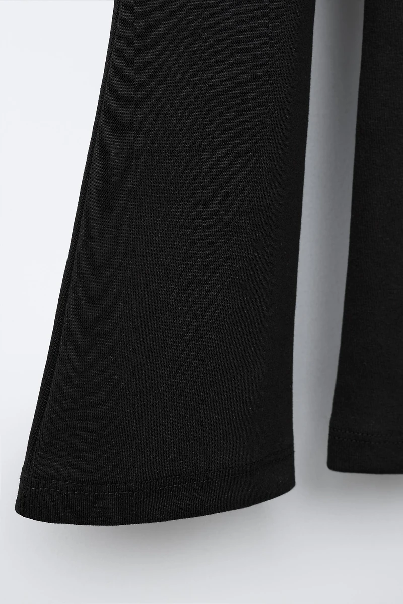 LABEL DETAIL INTERLOCK FLARE LEGGINGS
