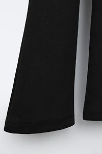 LABEL DETAIL INTERLOCK FLARE LEGGINGS